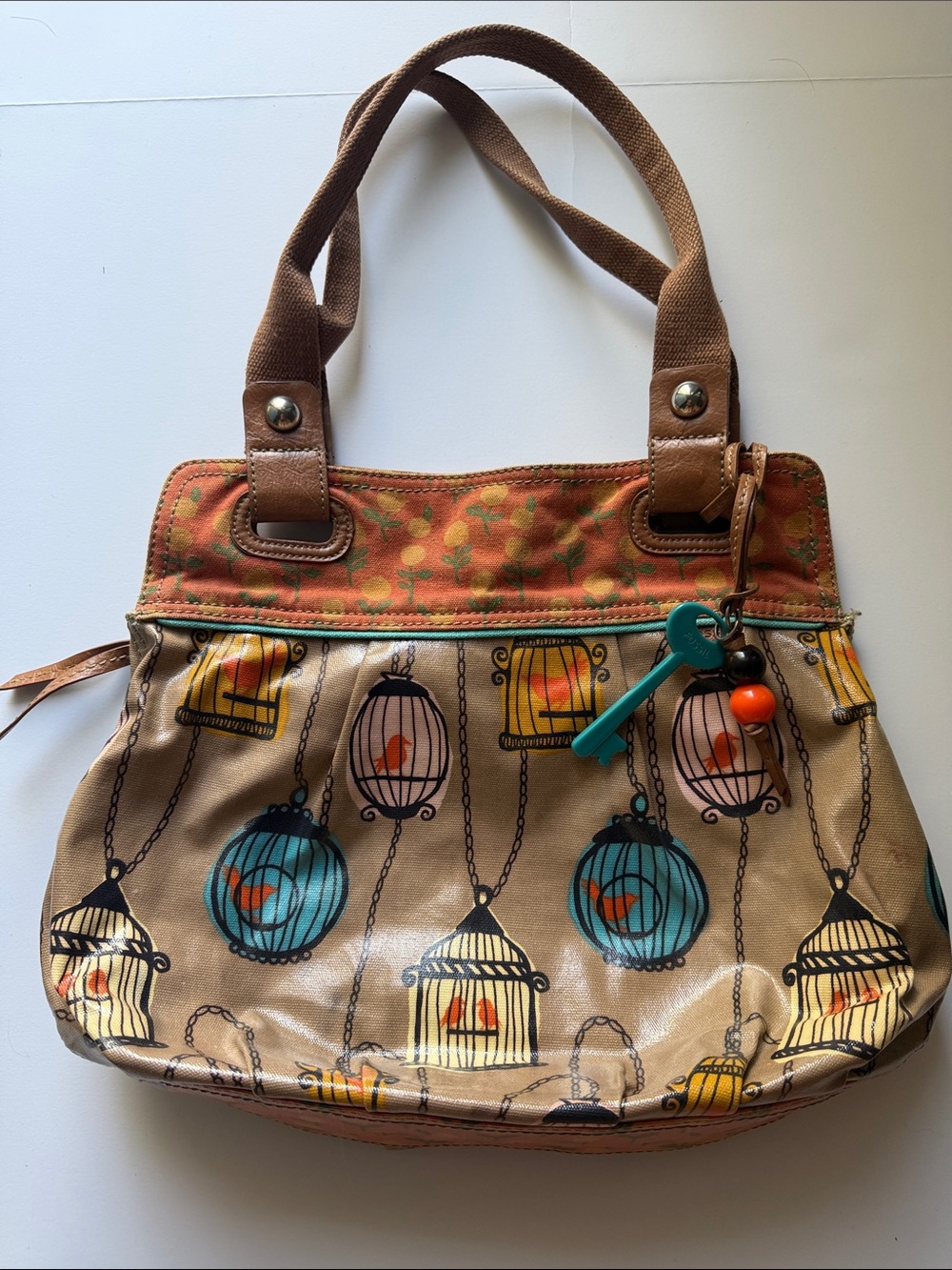 Fossil Key-per Canvas Tote Bag with Colorful Birdcage Print in Tan and Teal